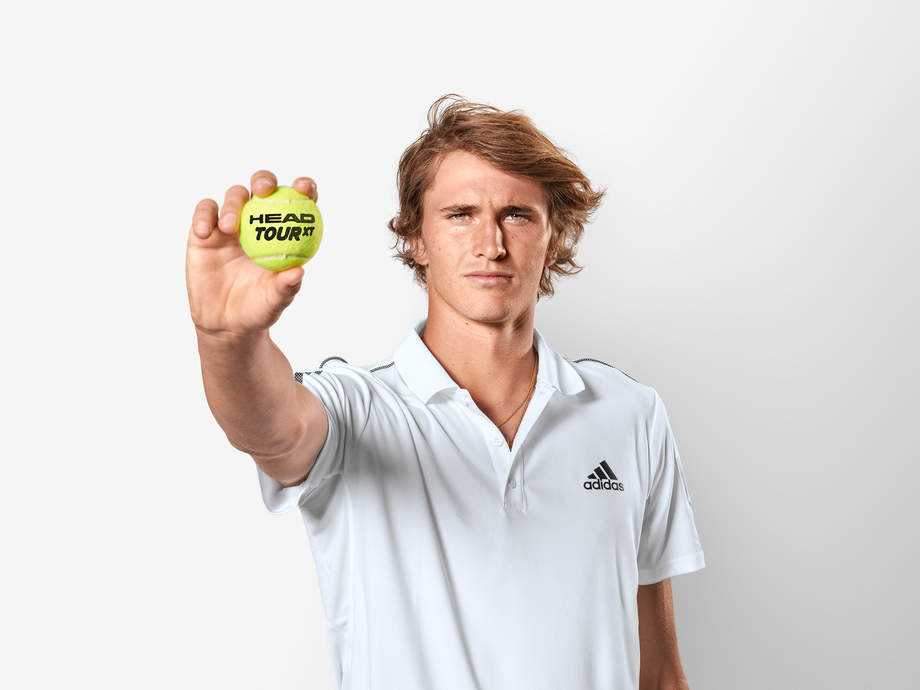 Alexander Zverev holding a Head Tour XT Tennis Ball
