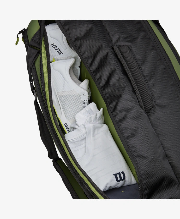 The Wilson Blade V8 Super Tour 9 Pack Racket Bag which tennis equipment inside for display purposes which is available for sale at GSM Sports.