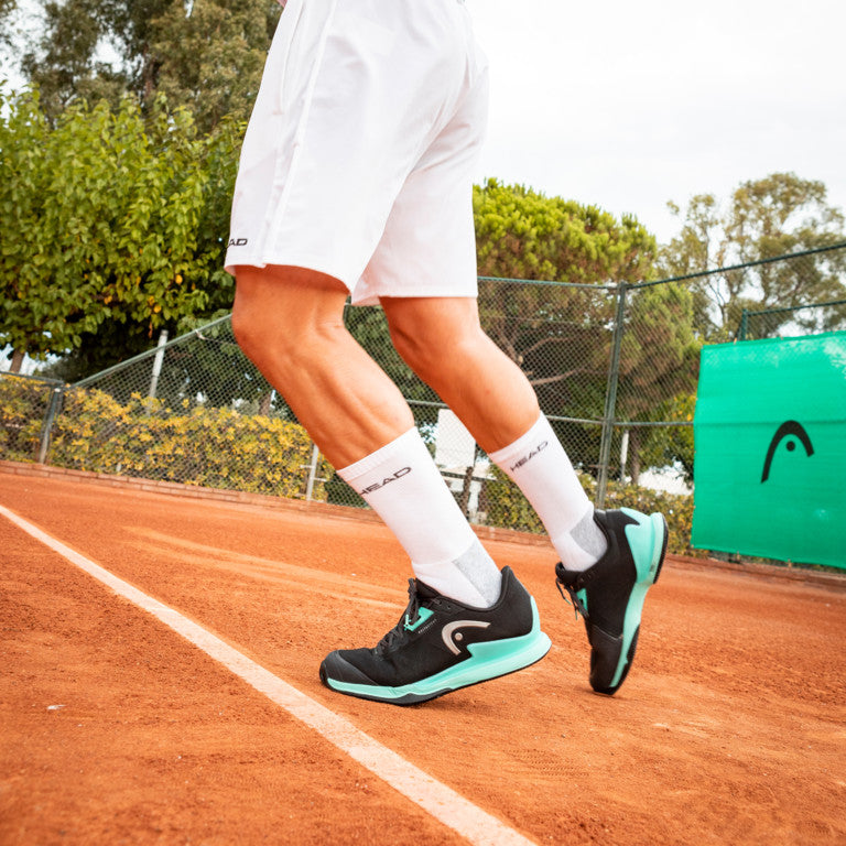 The Head Sprint Pro 3.5 Clay Tennis and padel shoes for men in black on a clay court available at GSM Sports.