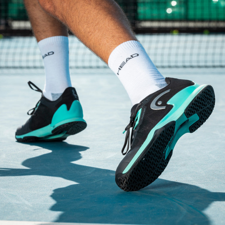 The Head Sprint Pro 3.5 Mens Tennis Shoe in Black on a hard court available at GSM Sports.