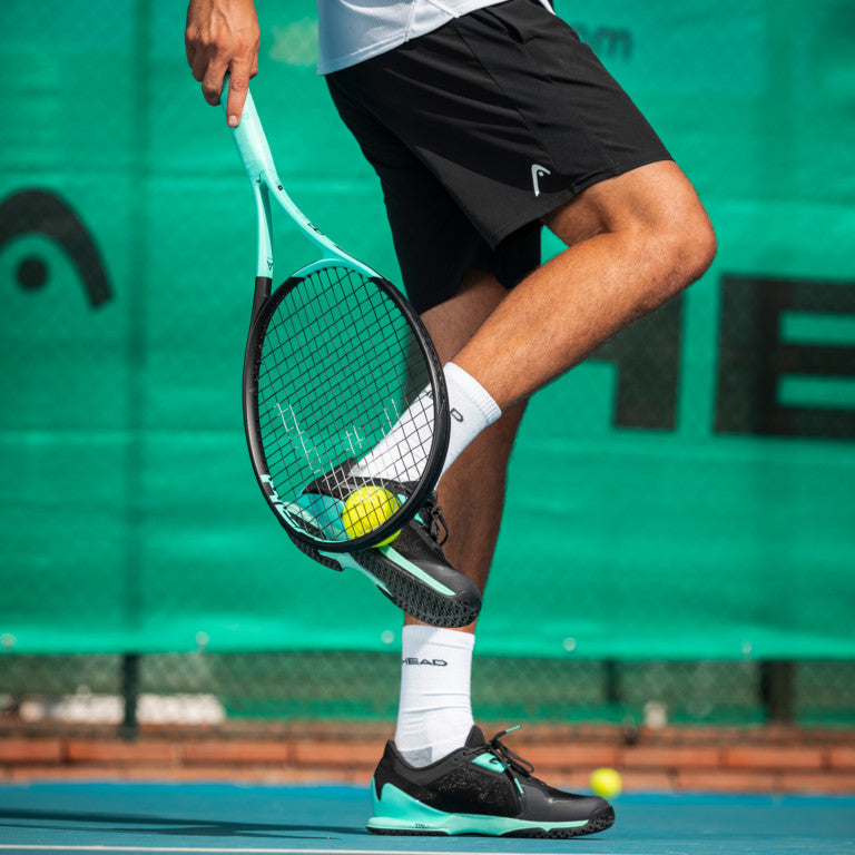 The Head Sprint Pro 3.5 Mens Tennis Shoe in Black on a hard court available at GSM Sports.
