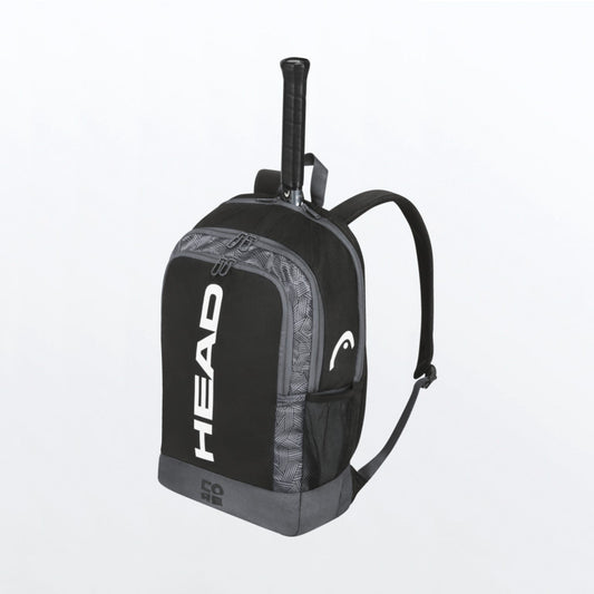 The Head Core Backpack which is for sale at GSM Sports with a tennis racket inside for illustrative purposes in black and white